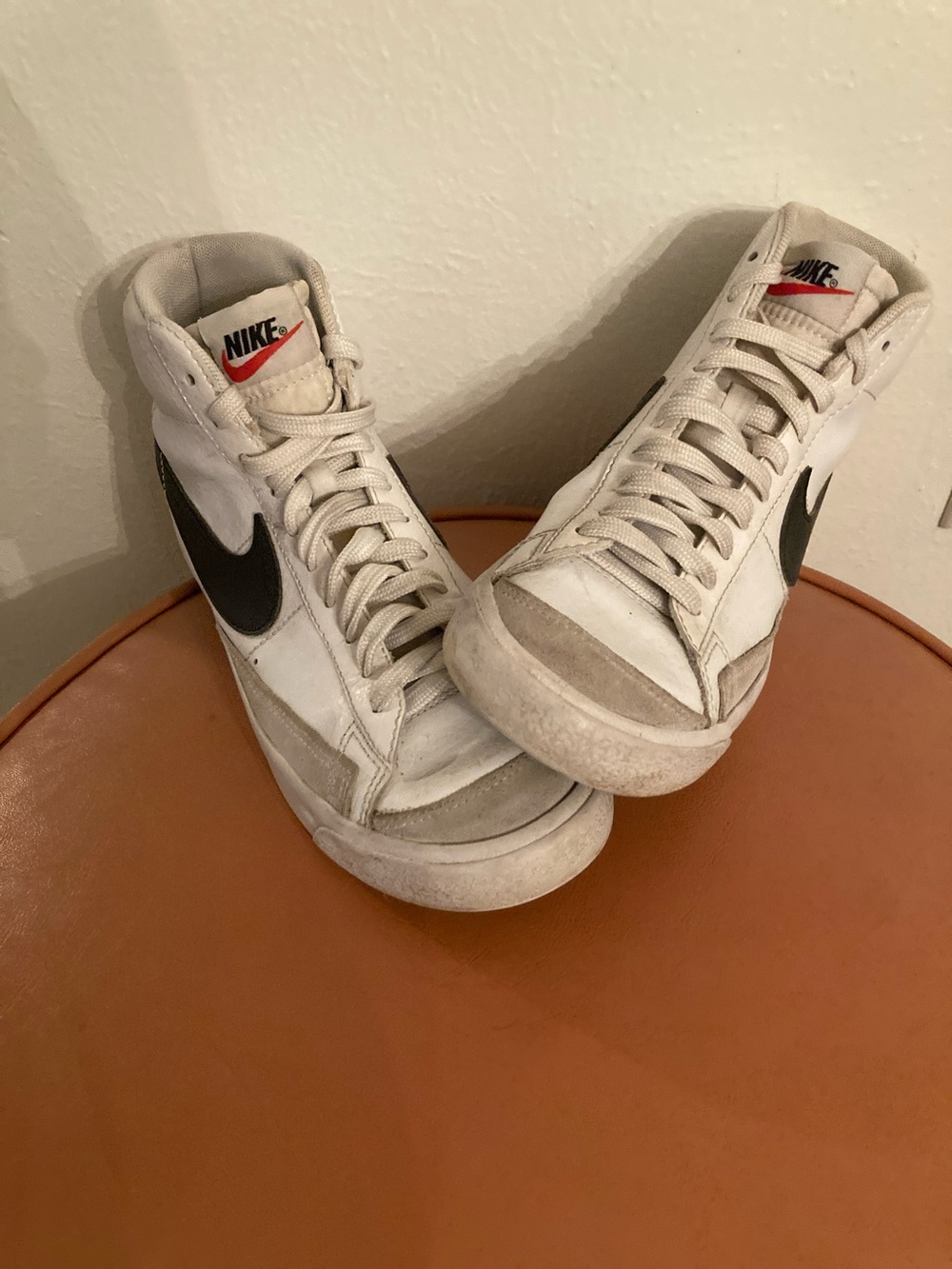 Nike White High-Top Sneakers with Black Swoosh and Red Tongue Accent
